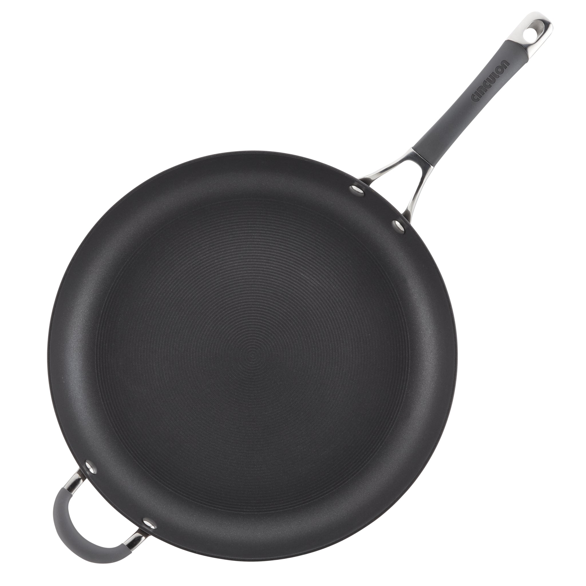 Black frying pan with a long handle and an additional loop handle.