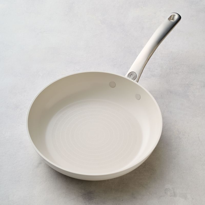 Ceramic Nonstick 10-Inch Frying Pan with metal handle on a light surface.