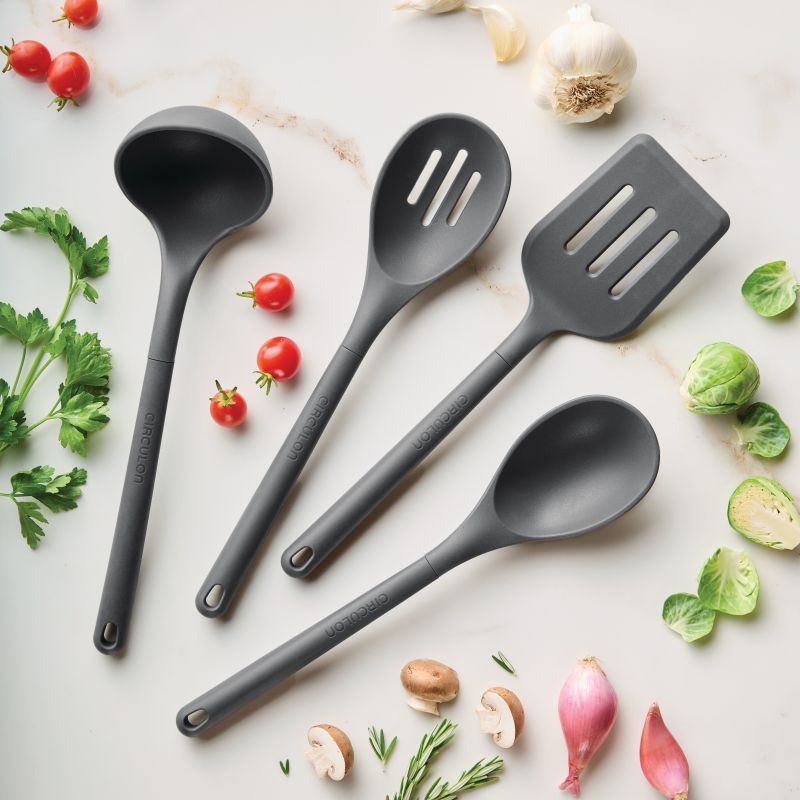 4-Piece Silicone Tools Set, black, dishwasher safe, shown with vegetables.
