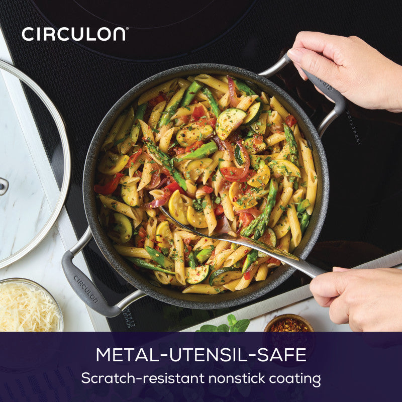 Someone holding a 5-Quart ScratchDefense Nonstick Dutch Oven with Lid.