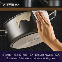 Wiping sauce off 5-Quart ScratchDefense Dutch Oven for easy cleanup.