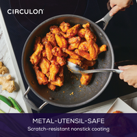 Chicken wings sizzle in a 13-Inch A1 ScratchDefense™ Nonstick StirFry Pan.