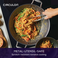 Person cooking shrimp pasta in a 14-Inch A1 ScratchDefense™ Nonstick Wok.
