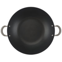 Top view of a black wok with two handles on the sides.