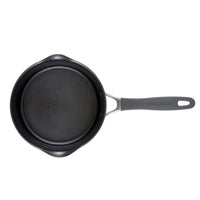Black non-stick saucepan with a gray handle, viewed from above.