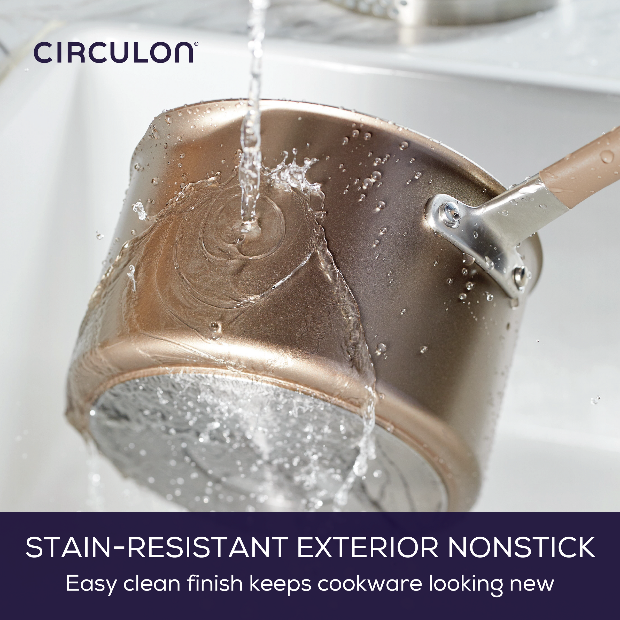 Water flows over a hard-anodized nonstick pot from the 8-Piece Nonstick Cookware Set in the sink, highlighting the set's durability and easy maintenance.