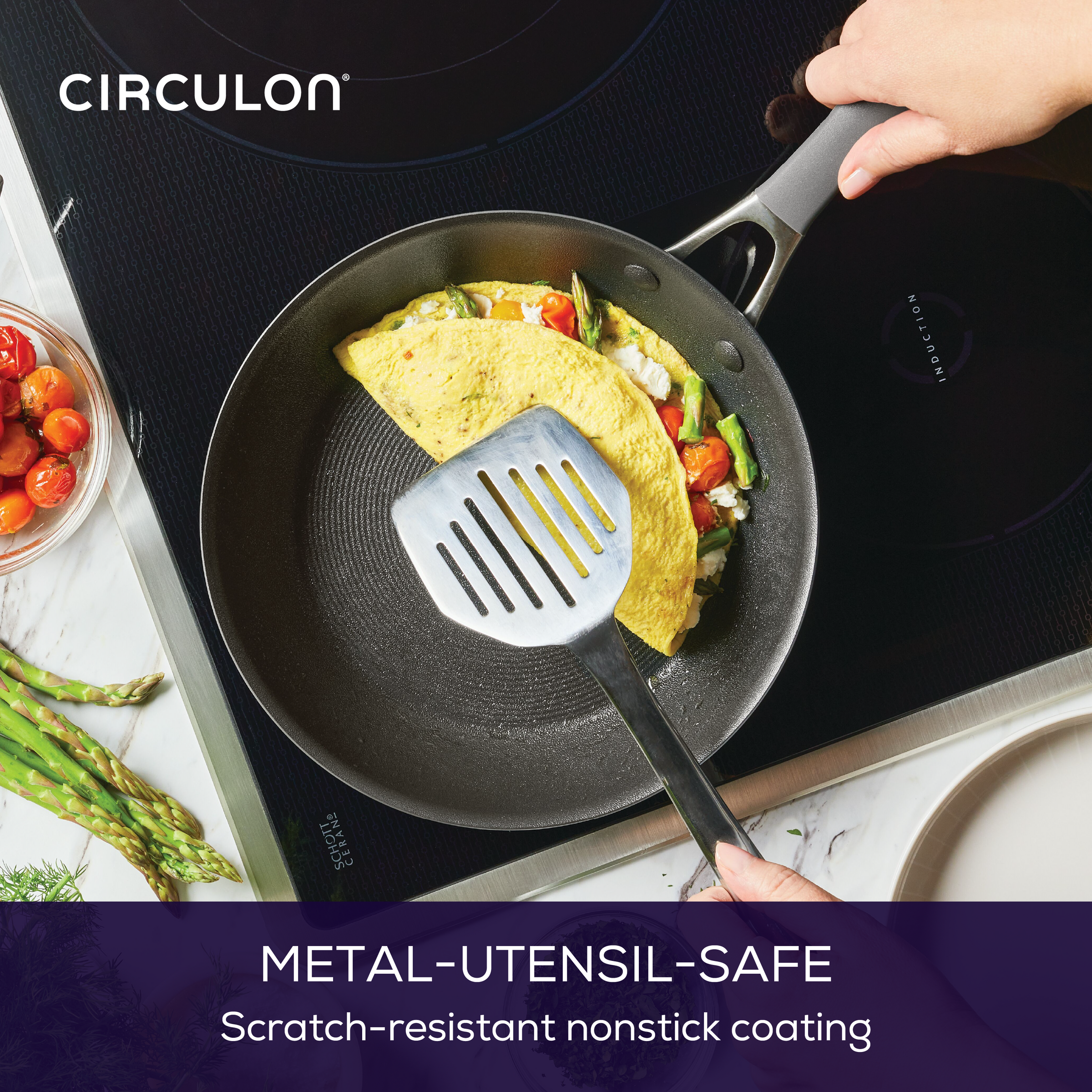 Person cooking an omelette in a nonstick frying pan on an induction stove.