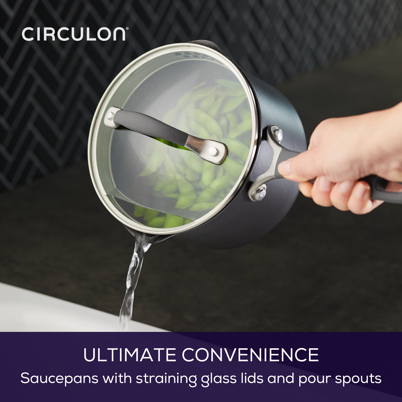 Pouring water from A1 ScratchDefense™ saucepan with glass lid and spouts.
