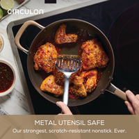 Cooking chicken in a ScratchDefense pan on an electric stove.