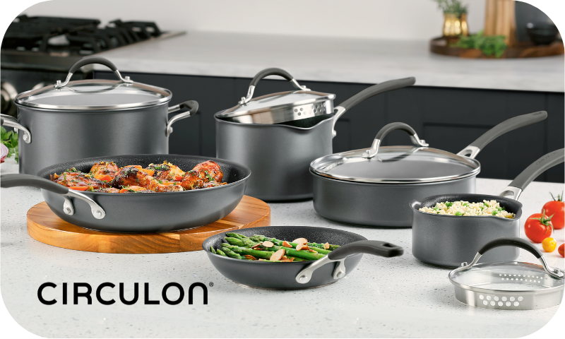 Displayed on the kitchen counter, the cookware set is surrounded by fresh food and vegetables, making it a perfect gift choice for any culinary enthusiast. Consider enhancing your gift with a thecirculon.shop Gift Card, which can be redeemed at checkout to unlock even more cooking possibilities.