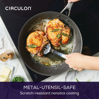 Cooking chicken in a 12" ScratchDefense™ pan on an induction stove.