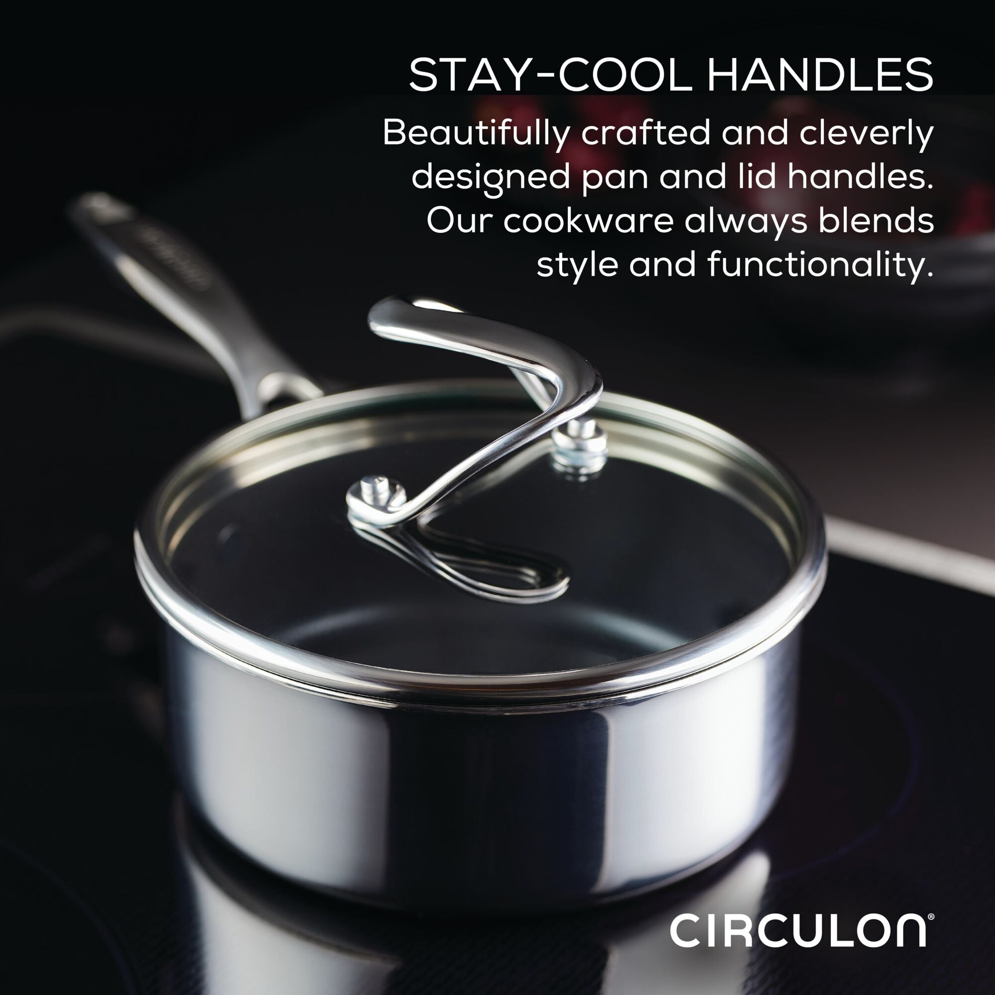Stainless steel pan with stay-cool handle on a stovetop.