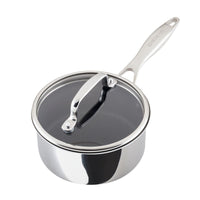 A stainless steel saucepan with a glass lid and a long handle.
