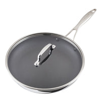 Stainless steel frying pan with a lid and ergonomic handle.