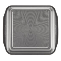 The 9-Inch Nonstick Square Cake Pan features a textured concentric circle pattern and durable steel construction for lasting use. This nonstick baking pan is oven safe, providing consistent results with every bake.