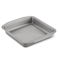Introducing the 9-Inch Nonstick Square Cake Pan, featuring durable steel construction, raised edges, and a textured bottom to ensure perfect bakes every time.