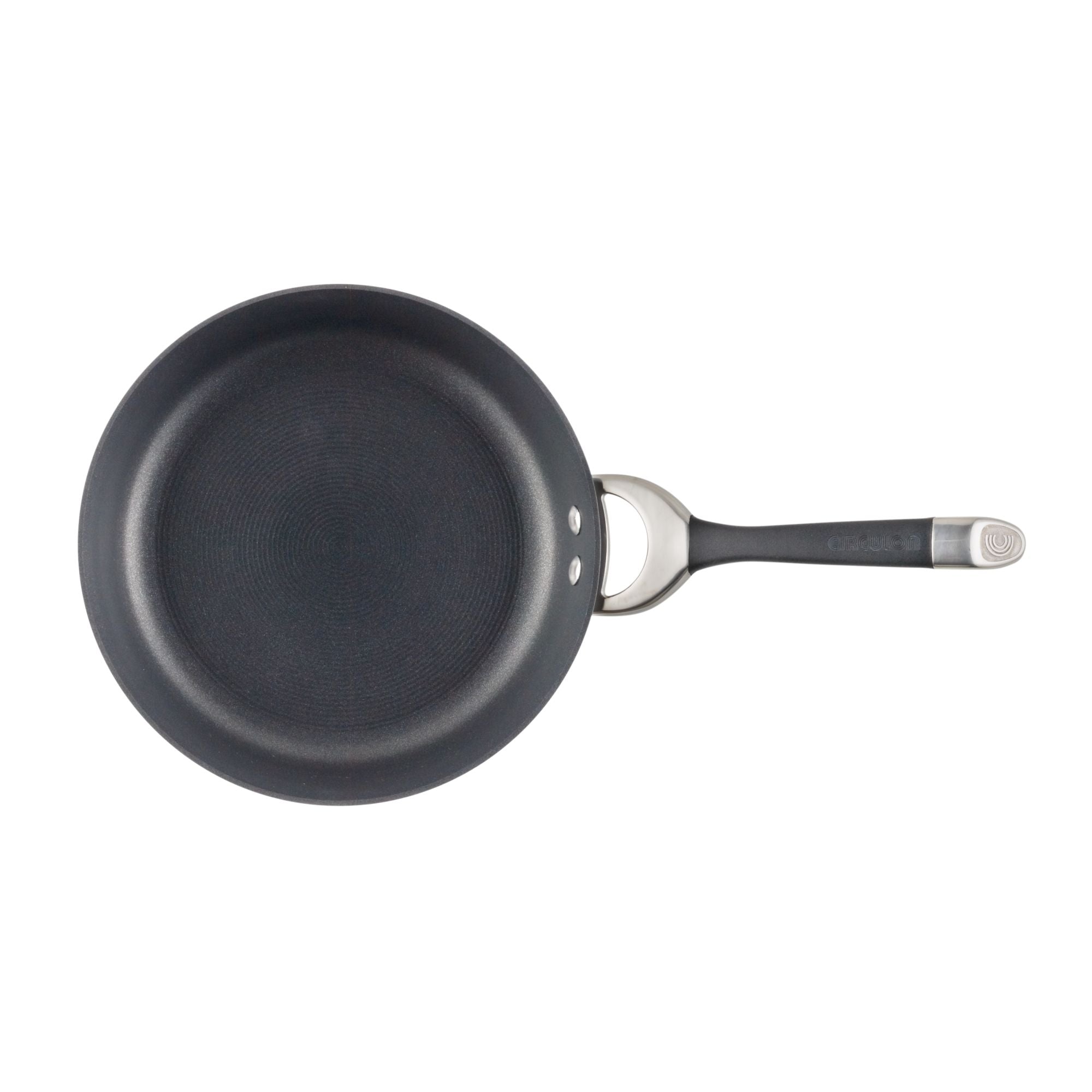 Black frying pan with a metal handle, viewed from above.