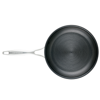 The 8.5" & 10" Tri-Ply Clad Nonstick Frying Pan Set, with its elegant design and sleek white handle, incorporates advanced SteelShield technology for outstanding cooking performance when viewed from above.