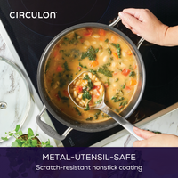 Person ladles soup from an 8-Quart ScratchDefense™ Nonstick Stockpot.