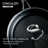Circular frying pan with swirling design, from 10-Piece Hybrid Steel Cookware Set.