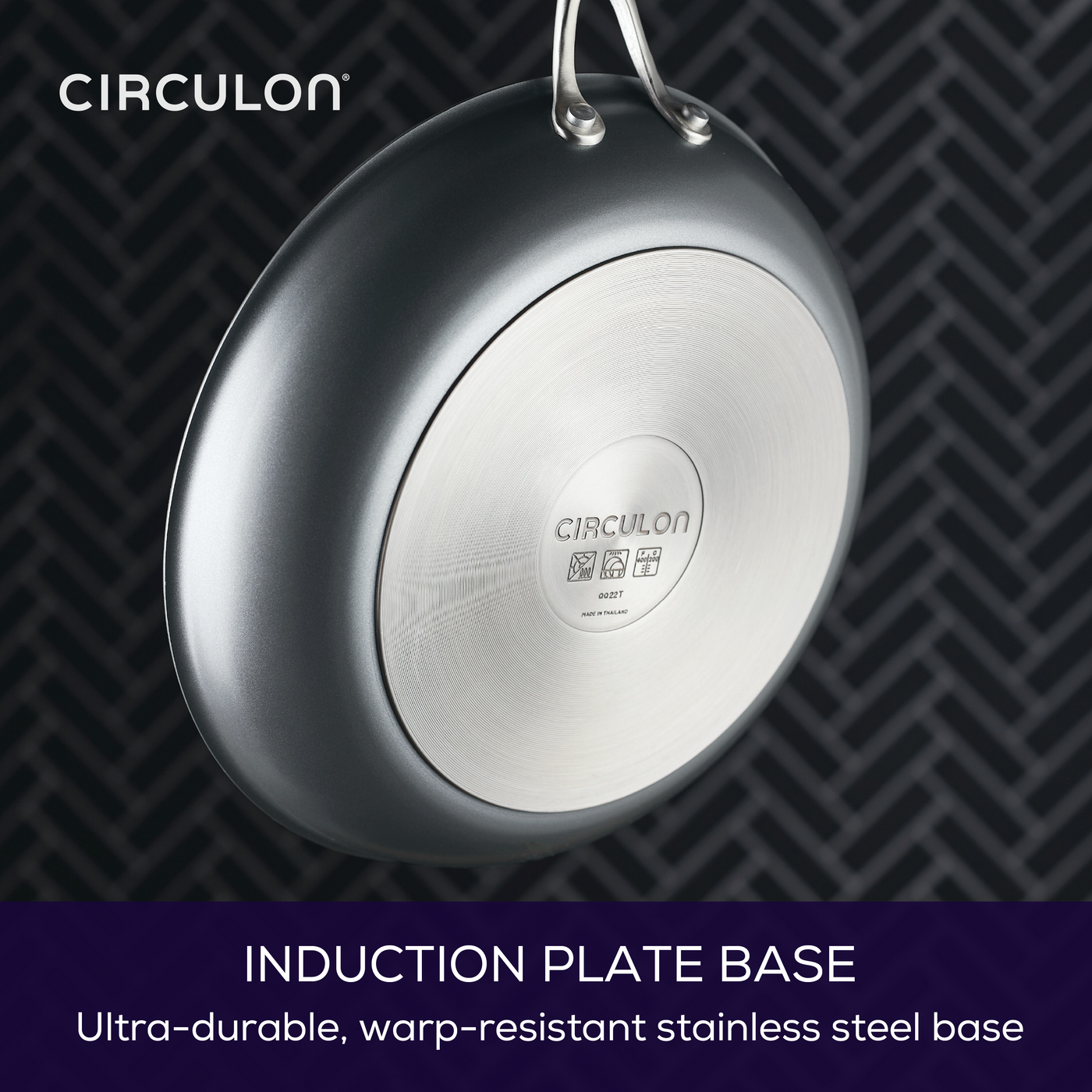 Nonstick pan from ScratchDefense™ set hangs on patterned wall.