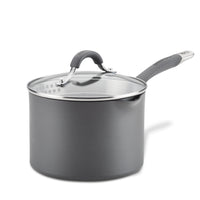 Introducing the 3-Quart Nonstick Straining Saucepan, designed in gray with a durable hard-anodized construction, this saucepan features a glass lid and a long handle for ease of use.