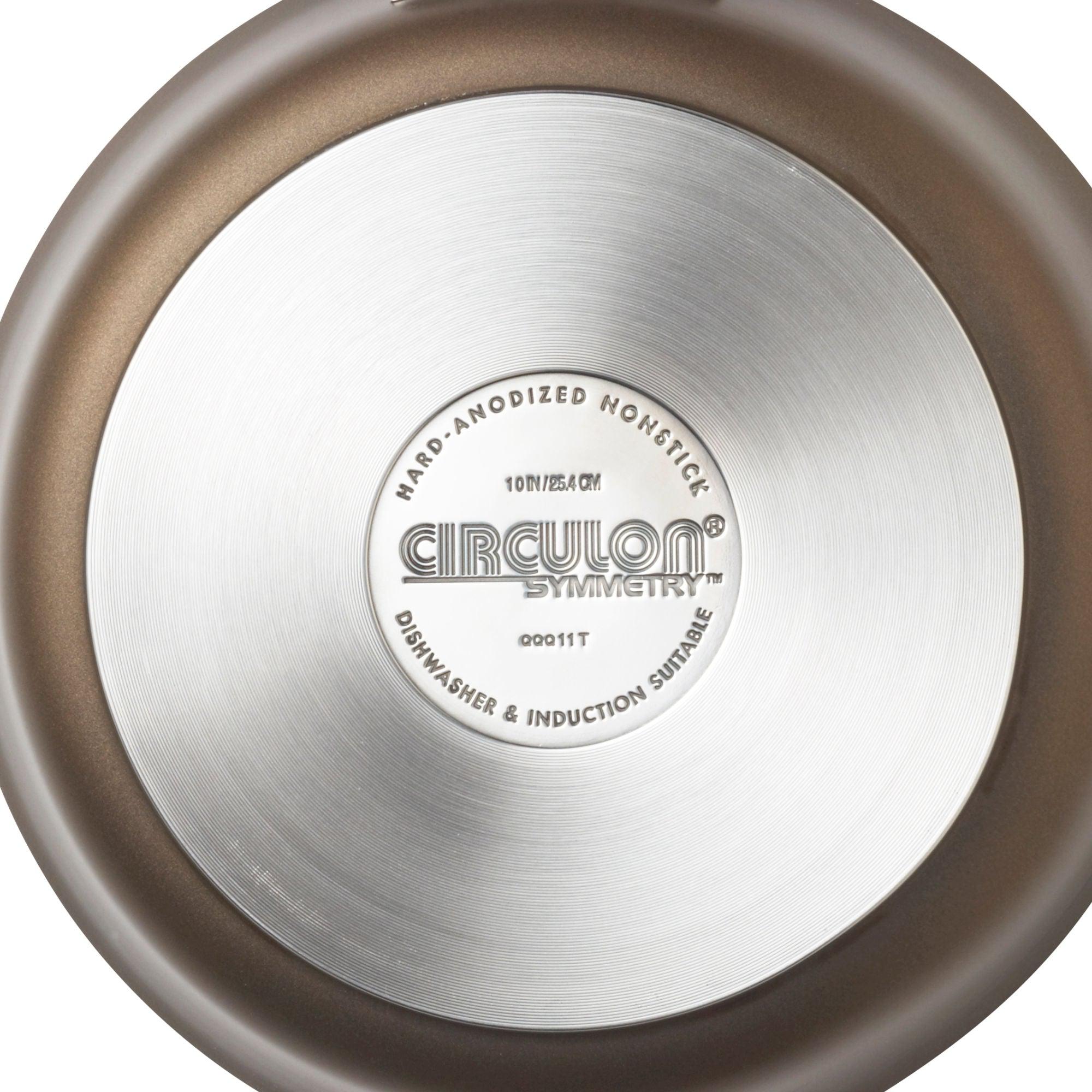 Bottom of a pan from the 11-Piece Cookware Set: Nonstick & Hard-Anodized, featuring hard-anodized construction and product details in the center.