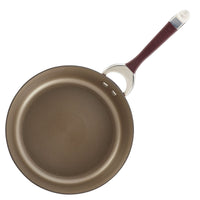 A frying pan from the 11-Piece Cookware Set: Nonstick & Hard-Anodized, featuring a brown non-stick surface and maroon handle, crafted with hard-anodized construction for enhanced durability, viewed from above.