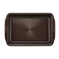 Rectangular pan from the 10-Piece Nonstick Bakeware Set, crafted with a textured surface and heavy gauge steel for added warp resistance and durability, complete with easy-grip handles.