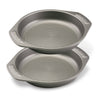 The 2-Piece 9-Inch Nonstick Cake Pan Set consists of two heavy gauge steel cake pans, each equipped with handles for easy maneuvering. The unique interiors of these baking pans guarantee flawless results every time.