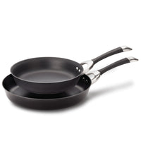 A set of Hard-Anodized Frying Pans, equipped with an advanced nonstick system, comes with elegant stainless steel handles and is safe for use on induction stovetops.