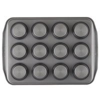 The Nonstick Muffin Pan is a 12-cup baking essential, adorned with concentric circle designs and a nonstick surface for easy cleaning. Designed for reliable oven performance, it's perfect for baking muffins or cupcakes.