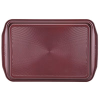 2-Piece 10" x 15" nonstick cookie pan set with textured circles pattern.