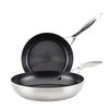 A set of 8" and 10.25" hybrid stainless steel frying pans with nonstick textured interiors, suitable for induction cooking.